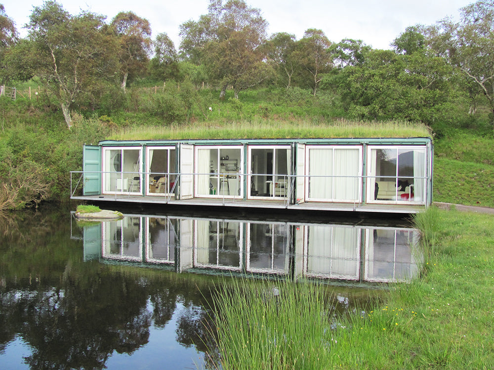 Accommodation at Cove Park - A set of modified shipping containers with a grass roof