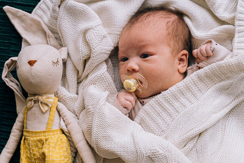 A baby with a toy