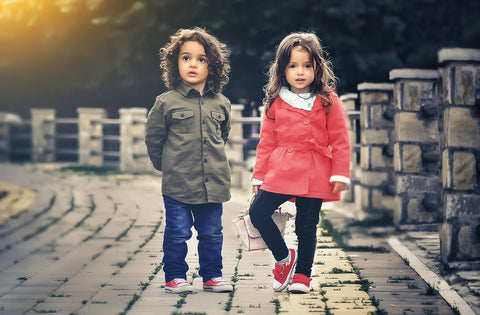 two kids walking together