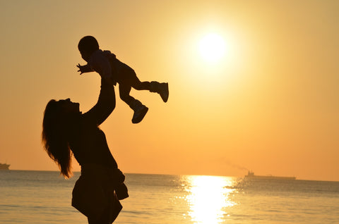 mother holding a baby