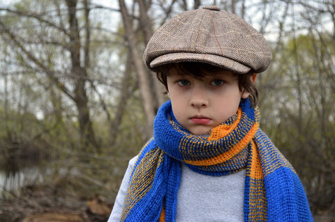 A boy dressed up fashionably for fun winter activities