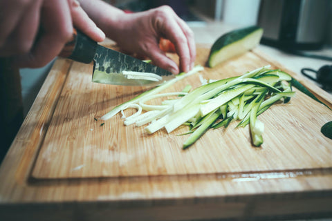 Chef Slicing Cucumber into Julienne Strip Cuts