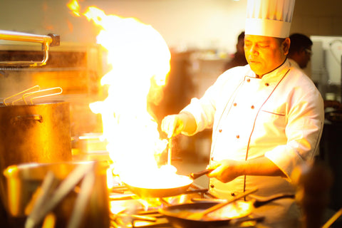 chef showing off how to flambe properly