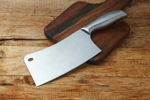 cleaver butcher knife on a wooden board