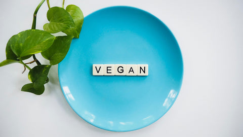 vegan word tiles in a blue plate