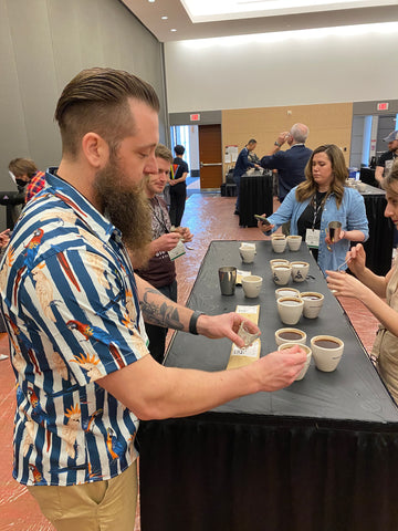 Mudhouse Head Roaster Eric Stone seen cupping coffees 