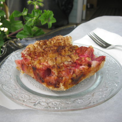 serving of rhubarb crisp on a crystal plate