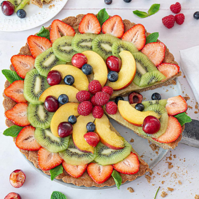 rainbow vegan fruit tart with custard filling