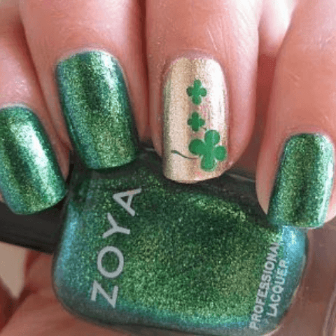 manicure with green glitter polish and shamrocks