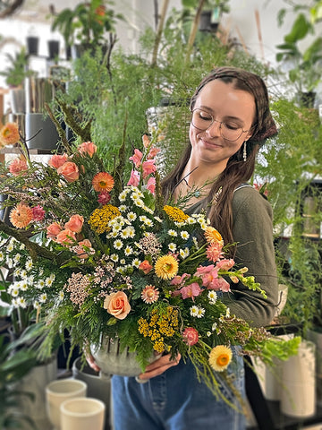 Cam with floral arrangement