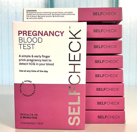 SELFCHECK Pregnancy Blood Test - stacked boxes on lab bench