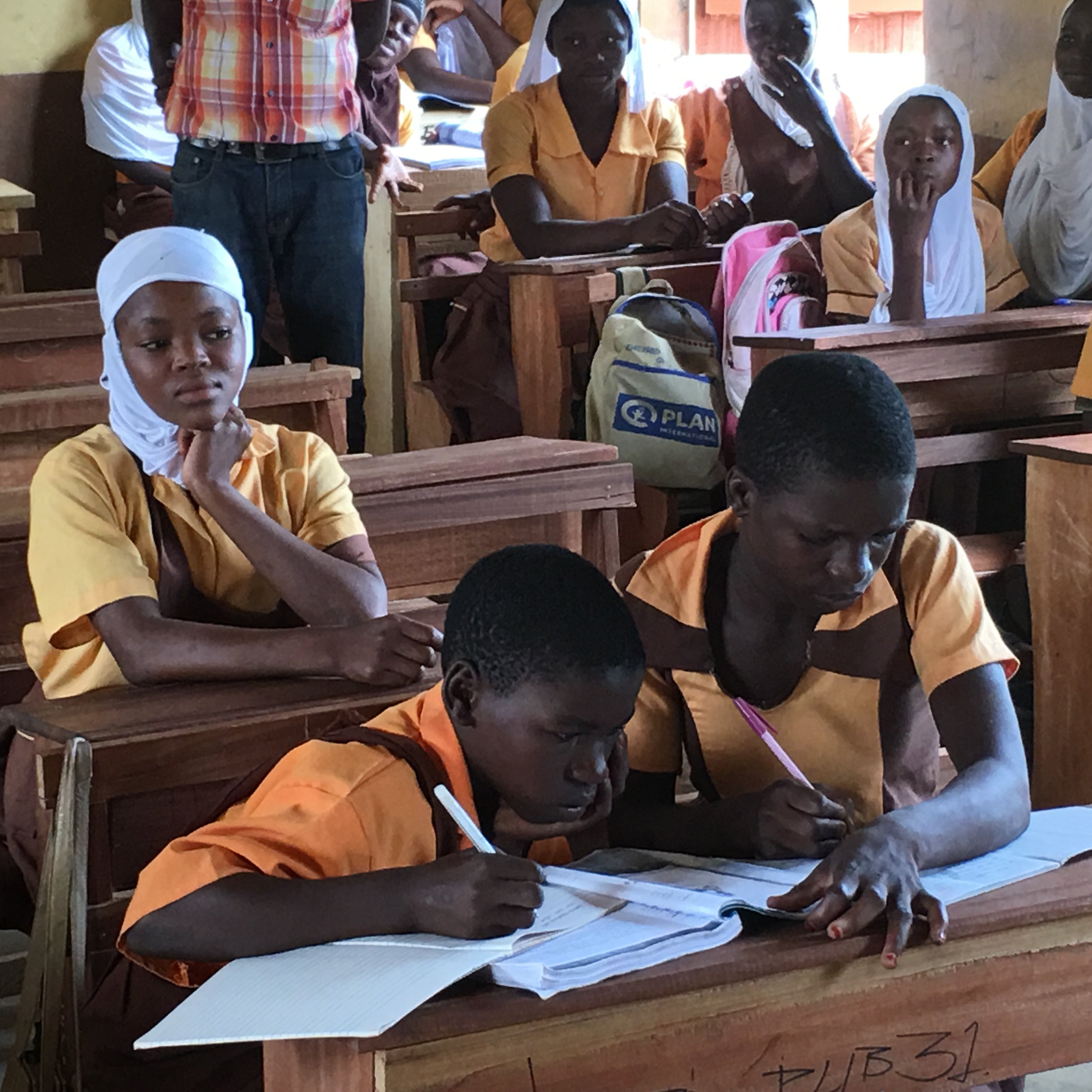 School children sharing desks