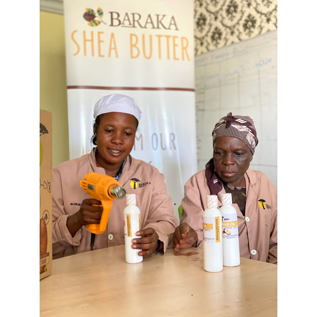 Lilian and Eunice sealing Baobab Oil