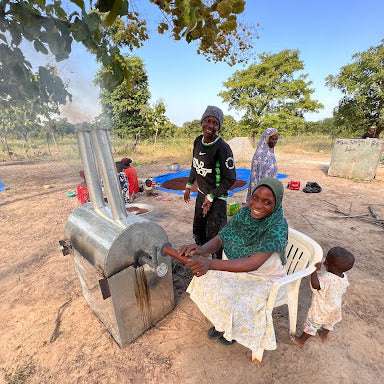 Konjeihi woman working with the new shea roasters. 