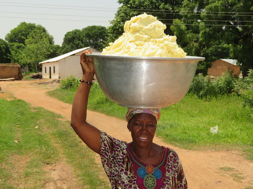 Woman carrying shea butter