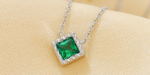 White gold and emerald necklaces