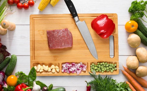 Large cutting board from NovoBam measures approximately 18 inches by 12 inches, providing ample space for chopping, slicing, and dicing fruits, vegetables, and meats. The board is also reversible, with a flat surface on one side and a juice groove on the other, making it ideal for cutting juicy fruits and meats