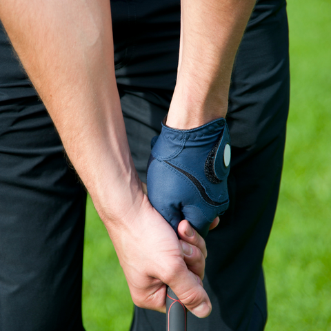 man gripping a golf club