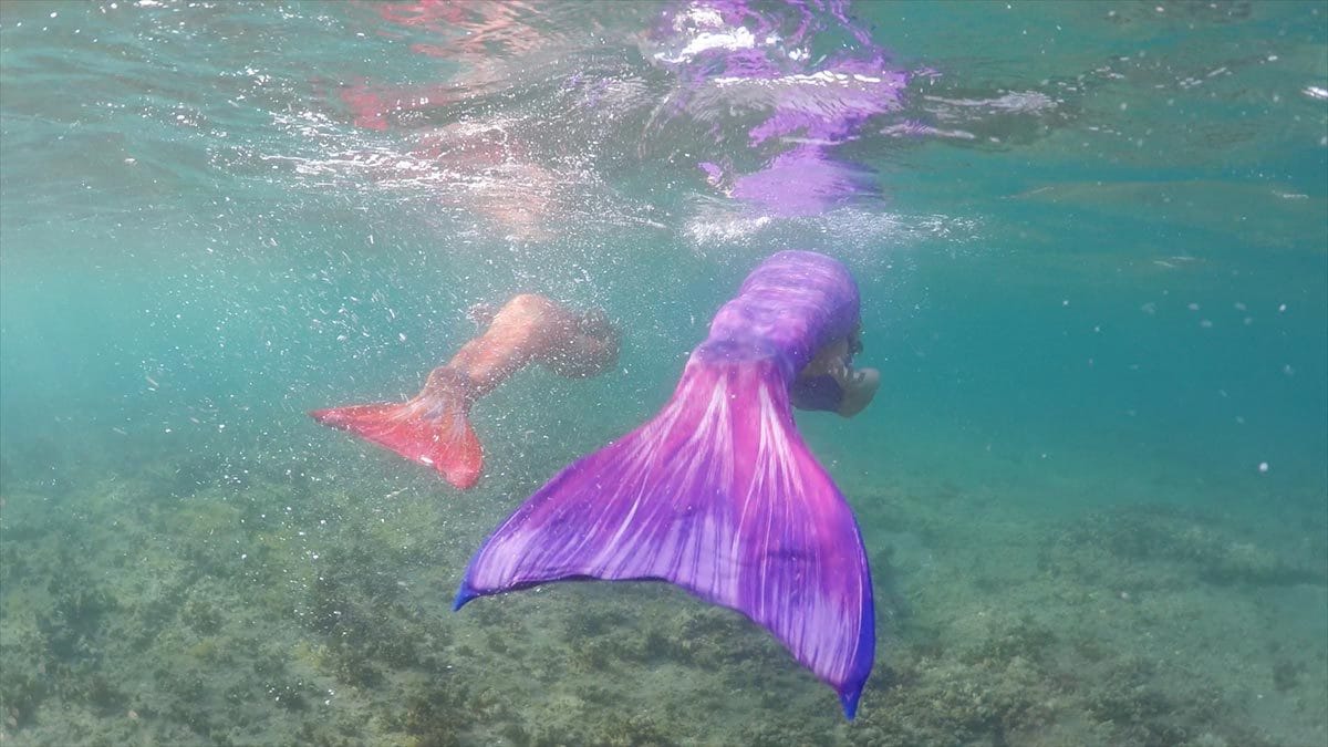 Underwater mermaids in the ocean