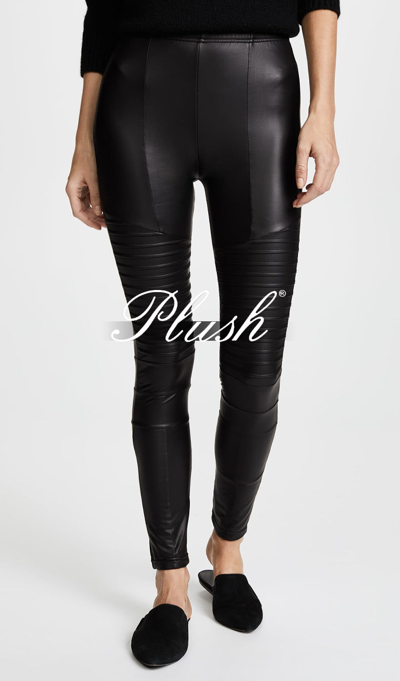 model wearing a black leather legging
