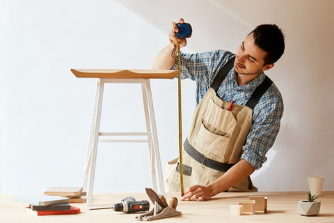 a man building custom furniture
