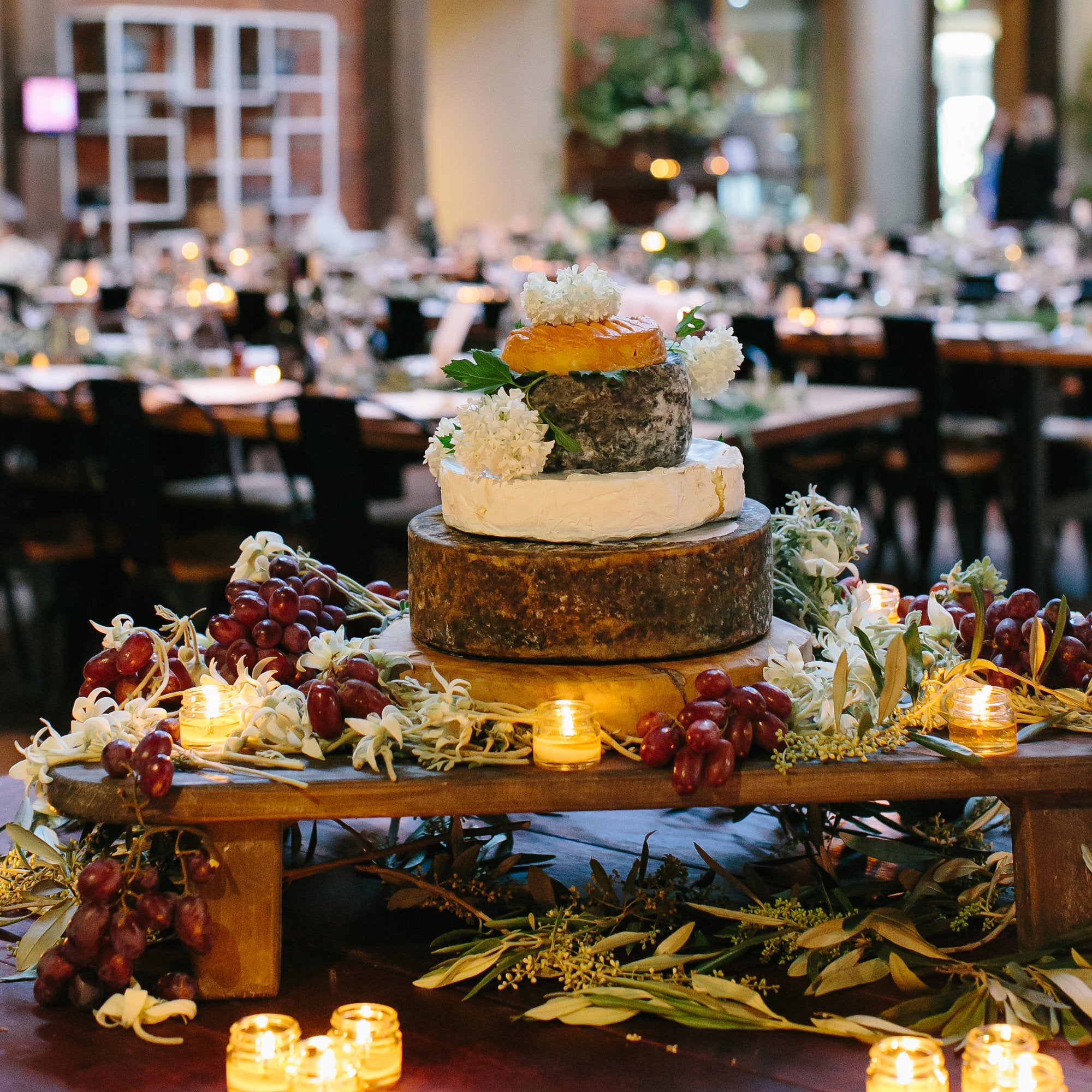 Dessert cheese wheel, wedding dessert table centrepiece idea, love katie and sarah photography, cecilia fox flowers