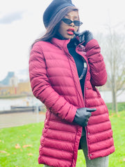 Outfit shot of person wearing red coat posing facing the camera