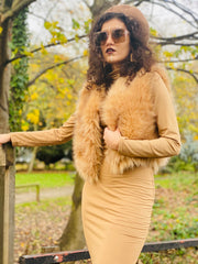 Portrait photo of person wearing rented golden caramel furry waist coat