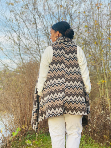 Outfit shot of person wearing zig zag waistcoat facing away from camera