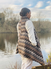 Outfit shot of person wearing brown zig zag waist coat facing the side