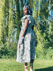 Portrait photo of woman wearing rented wrap dress | One Wear Freedom