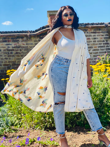 Portrait photograph of woman wearing rented Cream Bombyx Mori Forget-Me-Not Reversible Coat | One Wear Freedom