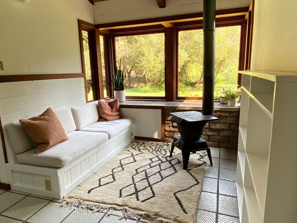 Contemporary living room featuring a white and black Moroccan rug