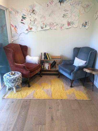 Contemporary living room featuring a yellow Moroccan throw rug