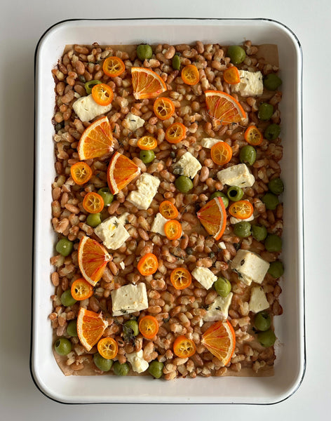Sheet-pan beans with feta, citrus, and olives