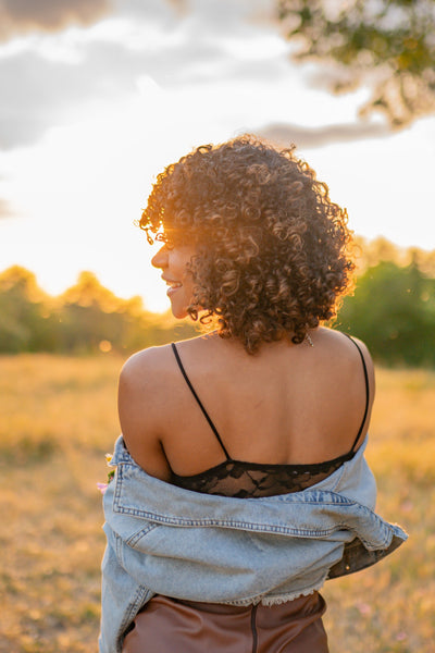 beautiful curly woman in a field