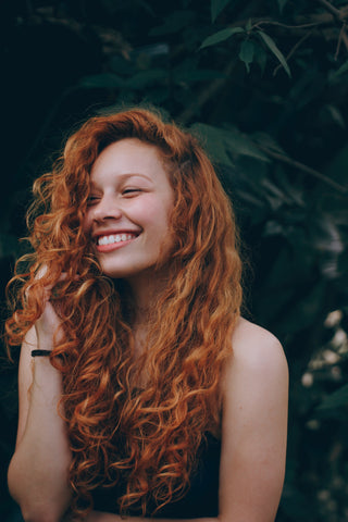 woman with beautiful red hair and curls