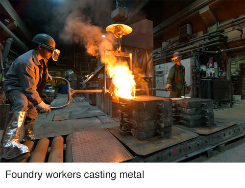 Foundry workers casting metal