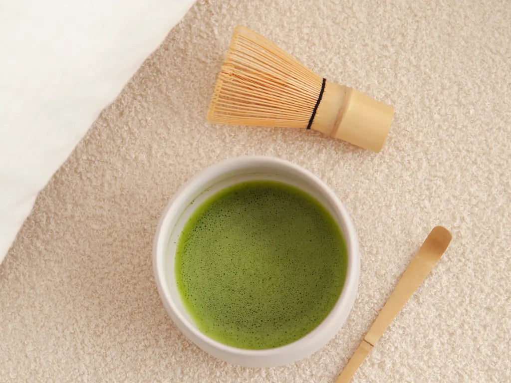 Matcha bowl with light-colored bamboo accessories