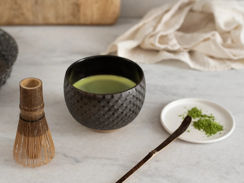 Matcha preparation with chasen and bowl