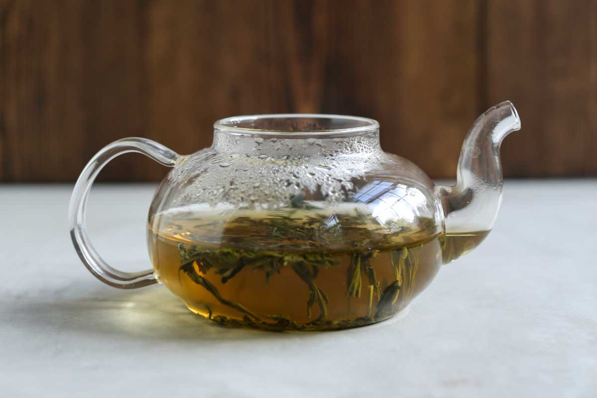 brewing green tea in a pot