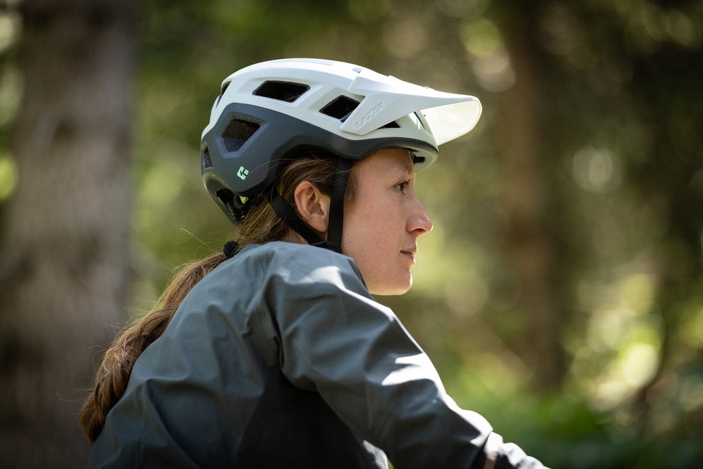 Women wearing a Lazer Sports Coyote Kineticore mountain bike helmet with rotational impact protection