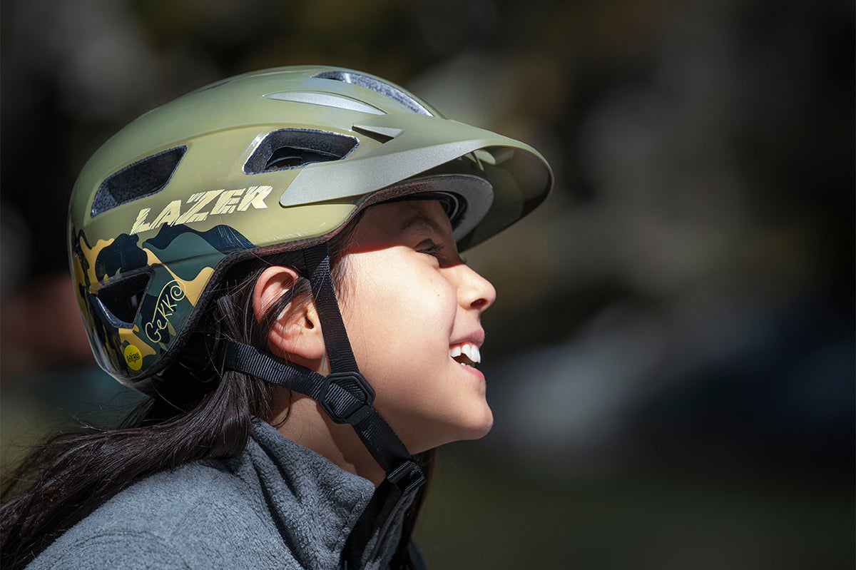 Young girl wearing a Lazer Gekko MIPS bicycle helmet