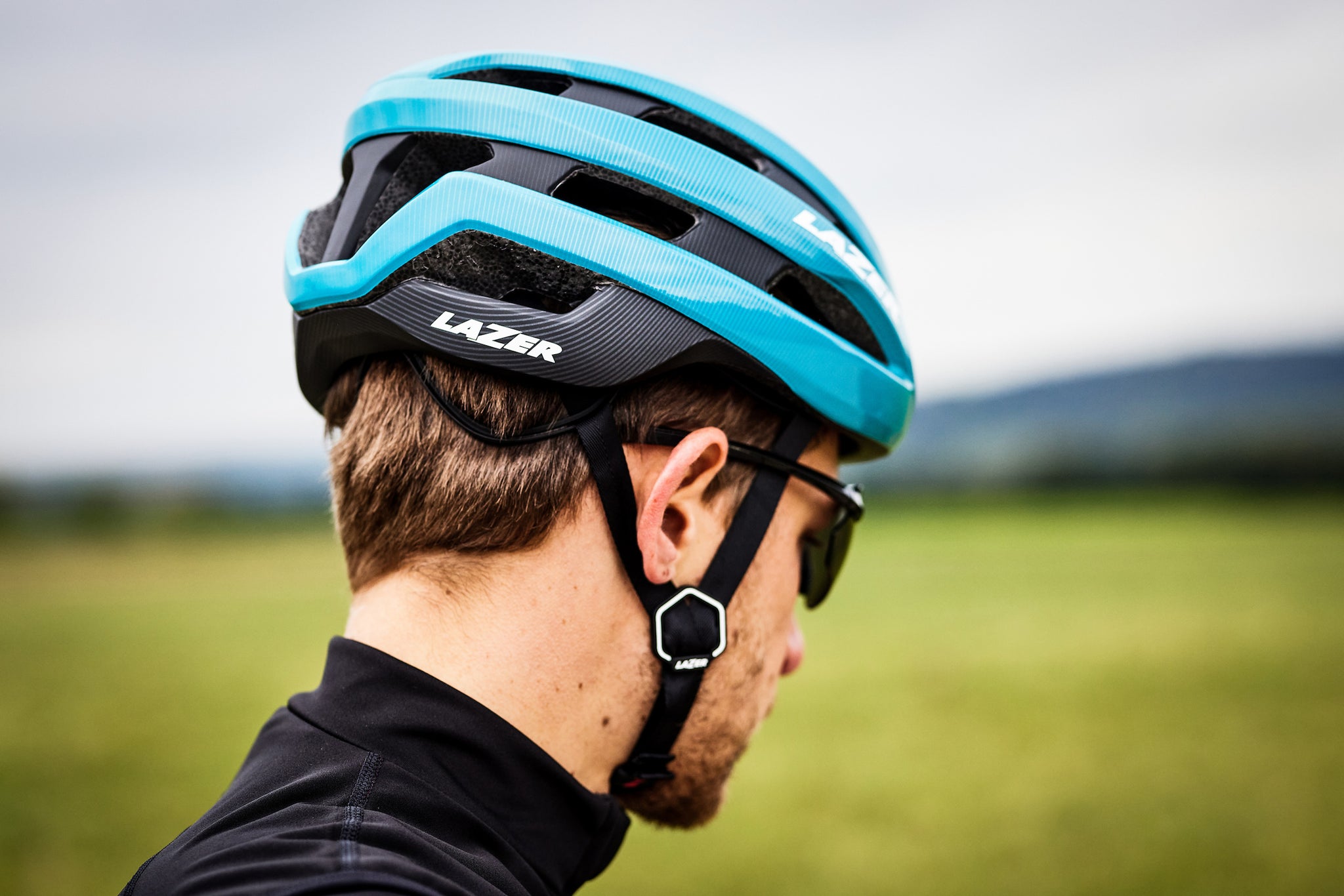 Man wearing a Lazer Sphere MIPS road cycling helmet 