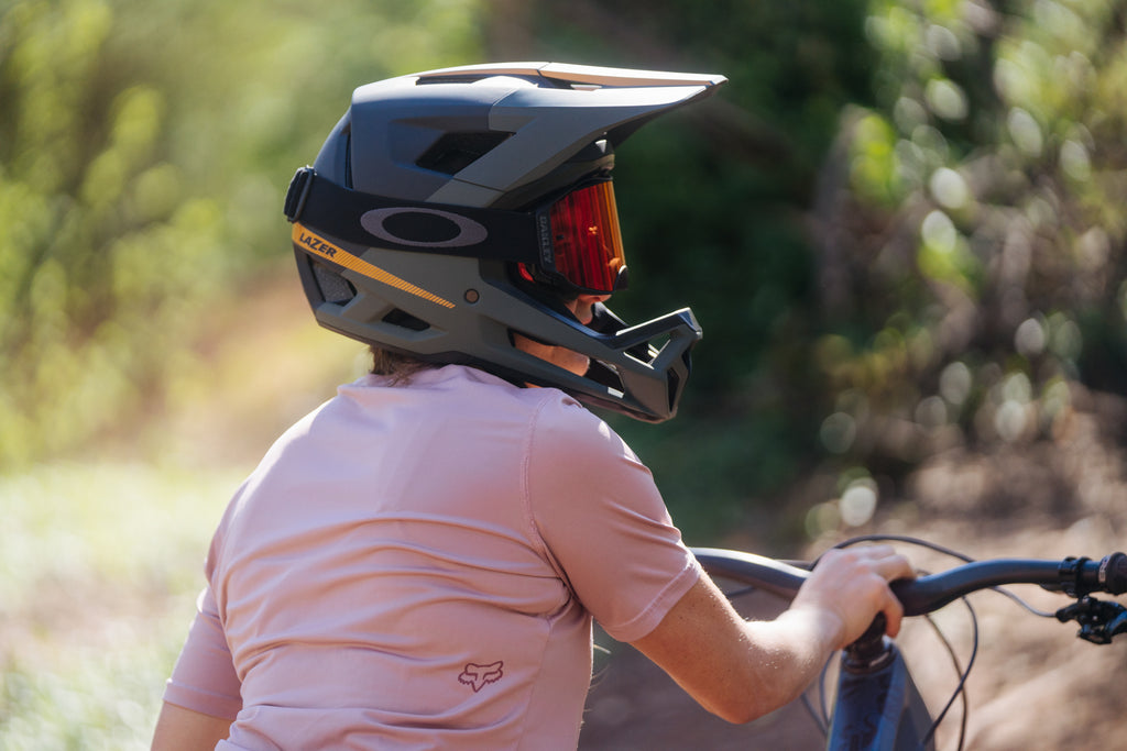 Women wearing a Lazer Cage KinetiCore Full Face Mountain bike helmet