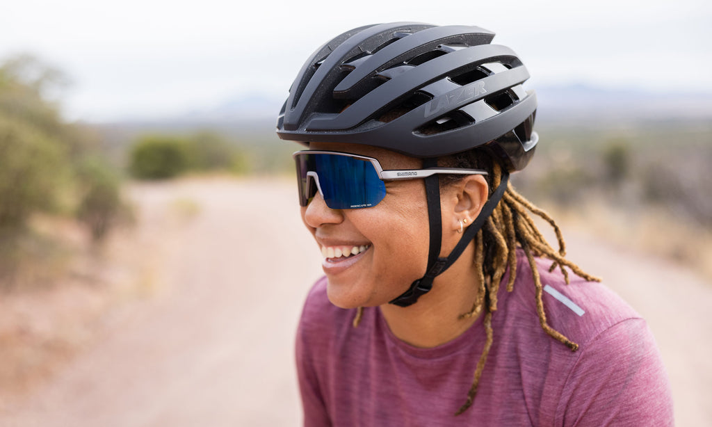 Lisa Muhammad wearing a Lazer Z1 KinetiCore road bicycle helmet while riding her gravel bike