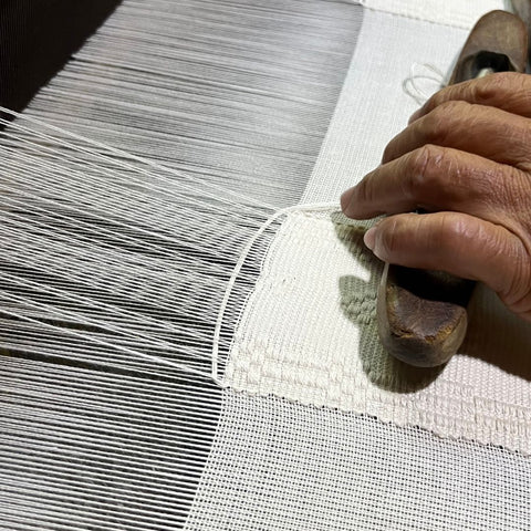 Pickup weaving. By manipulating selected warp yarns in combination with the regular weft, the weaver can produce complex and detailed designs on the fabric.