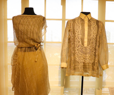 A traditional Filipino dress and barong made from piña fabric displayed at the National Museum of the Philippines - Photo by Irvin Parco Sto. Tomas/Wikimedia Commons