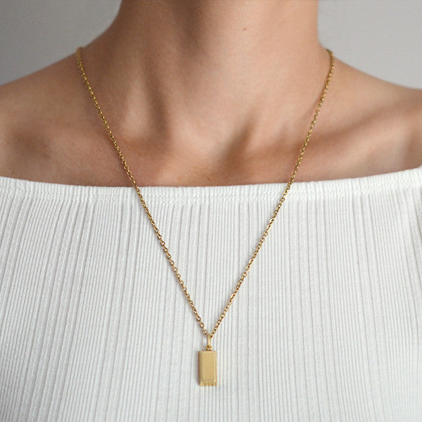 cartier gold bar pendant