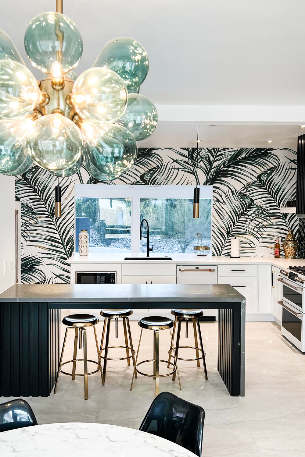 black and white classic palm leaves wallpaper in kitchen interior